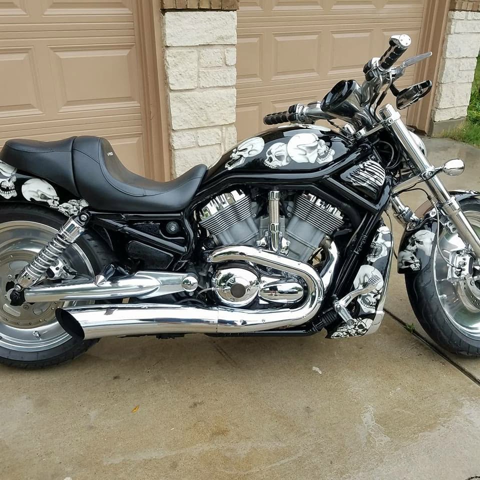 Full side profile of the custom painted V-Rod in daylight